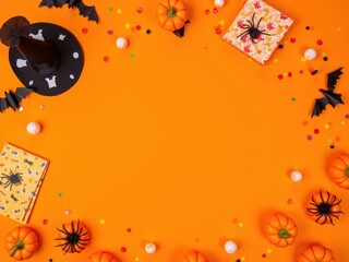 Bright Halloween flat lay with party props on orange