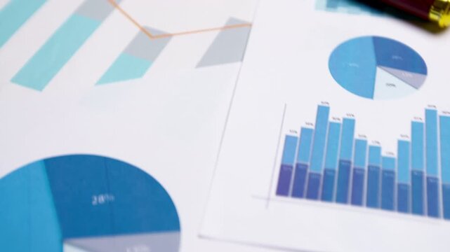 Concept of financial reports, statistics. Graphs and charts for close-up analysis.