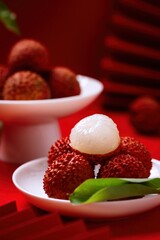 Fresh Juicy Lychees on White Plate with Red background