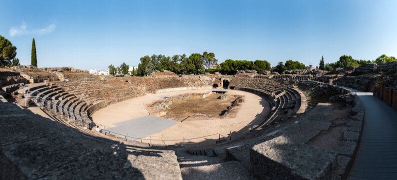 Panoramic view of ancient Roman amphitheater under clear sky, Merida, Spain