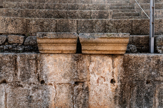 Detailed ancient stone seating with weathered textures, Merida, Spain