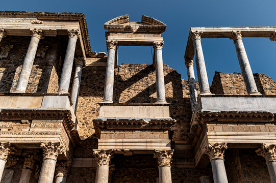 Frontal view of broken pediment and Corinthian columns in Roman theatre, Merida, Spain