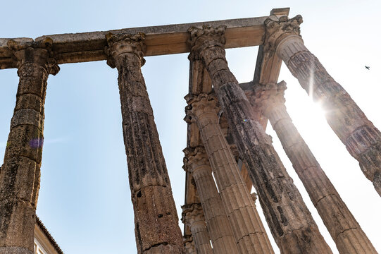 Sunlight filtering through Roman Temple of Diana weathered stone columns