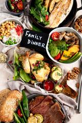 Family dinner table. Table full of homemade food.