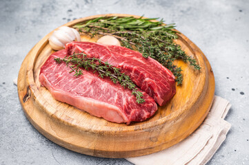 Raw beef marbled steak, Australian Oyster Top blade steak. grey background. top view