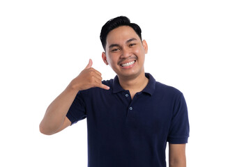 Smiling Asian man making call me hand gesture with friendly expression isolated on transparent...