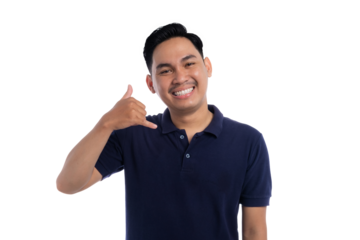 Smiling Asian man making call me hand gesture with friendly expression isolated on transparent background