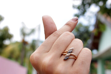 wedding rings in hand