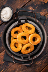 Crispy Fried squid rings, calamari fastfood snack. wooden background. top view