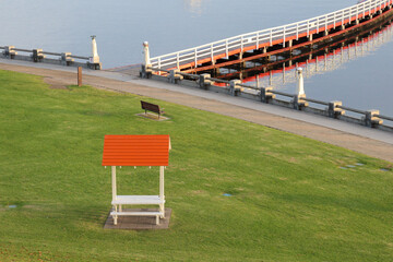 park bench overlooking pier on sea