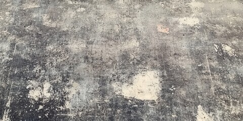Obraz premium Aged concrete surface with varied textures and colors.