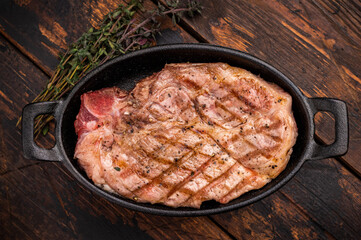 Roast pork tender loin steak, neck meat. wooden background. top view