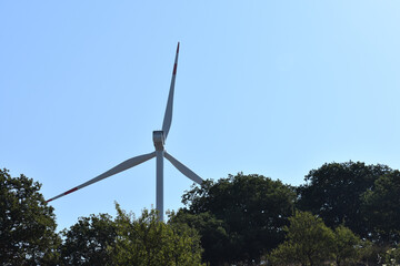 Wind turbine on the mountain in Sicily, Italy. Wind turbine and countryside Italian summer...