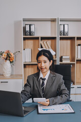 Young adult happy smiling Hispanic Asian student wearing headphones talking on online chat meeting...