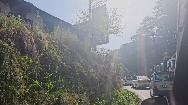 Manali, Himachal Pradesh, India 04 10 2025: car is crossing mountain village in Manali, Himachal Pradesh, India 

