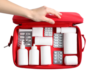 Female Hand Holding Open Red First Aid Kit Bag Showing Contents Inside, Angled Top-Down View, White Background