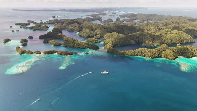 High-quality drone shot, wide shot of turquoise coastline and small tropical islands of Palau.
