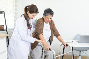 Doctor, patient, healthcare, aging, clinic support session, Caucasian specialist examines Asian...