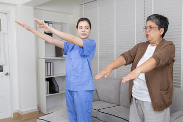 Caregiver or physical therapist with patient in clinic consultation checkup recovery progress,...