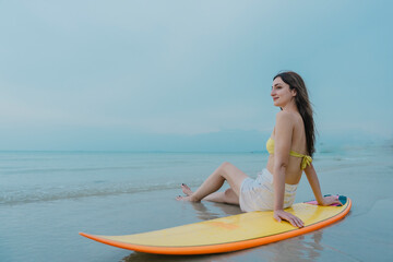 Happy beautiful young woman smiling at the beach side - Delightful girl enjoying sunny day. Summer holiday fashion concept. Young fashion woman relax on the beach.	
