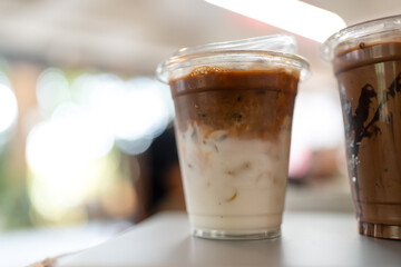 Iced latte coffee with two layers of fresh milk and espresso shot