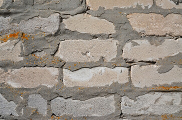Gray brick old wall close-up