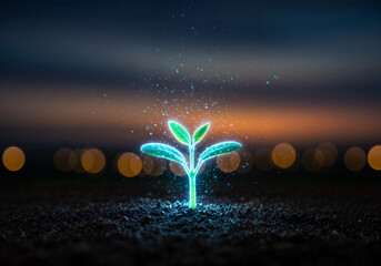 Young green plant growing amidst city lights at night, creating a vibrant urban backdrop at night.