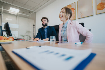 Dynamic scene capturing a collaborative moment between coworkers in business attire, fostering an...