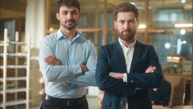 Caucasian men businessmen business partners friendly conversation dialogue talking in office coffee break drinking together guys male co-workers colleagues friends fellows meeting drink tea at company