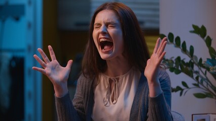 Annoyed woman mad angry Caucasian girl screaming loud at home single female yelling shouting...