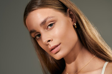 Bright summer beauty of a young woman with natural glow in a studio setting © LIGHTFIELD STUDIOS