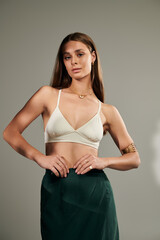 Summer beauty in natural light with tan skin and elegant style in a studio setting