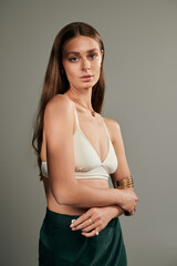 Natural summer beauty captured in studio with a modern grey backdrop