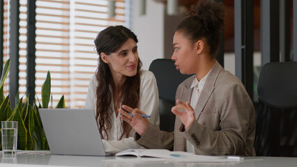 African American Caucasian businesswomen two female coworkers multiethnic business partners...
