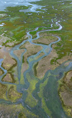 Aerial view from a drone of the low tide landscape in Santoña, in the marshes of the Santoña, Victoria, and Joyel Marshes Natural Park. Cantabrian Sea. Cantabria. Spain. Europe.