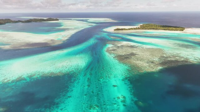 Stunning drone footage showcasing the crystal blue waters and islands of Palau. Revealing aerial drone shot.