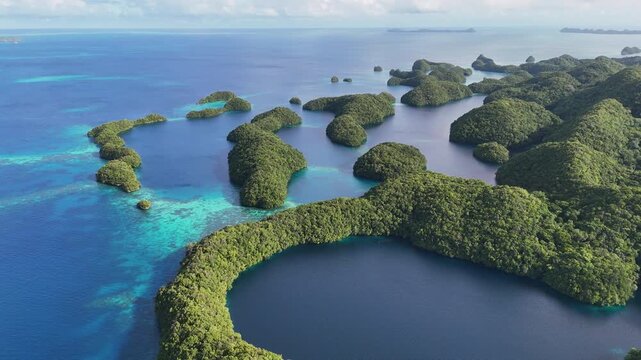 Breathtaking drone view showcasing the crystal blue waters and islands of Palau. Wide cinematic drone shot.