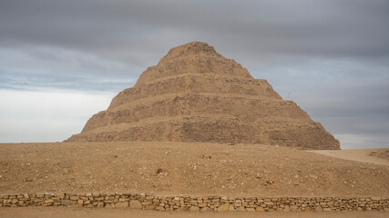 The Step Pyramid of Djoser at Saqqara, Egypt. An ancient architectural marvel from Egypt's Old Kingdom period.