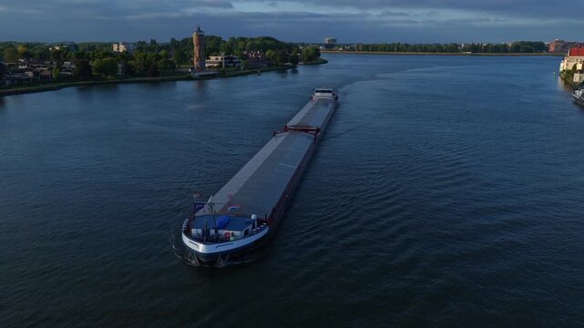 Maranta long cargo barge moving down the wide Oude Maas distributary, Dordrecht, Zuid-Holland, Netherlands.