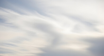 Abstract blurred image of soft white and gray clouds creating a dreamy and ethereal atmosphere view
