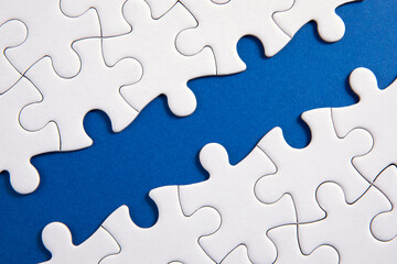 Obraz premium puzzle pieces with blue background 