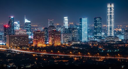 Obraz premium Stunning Panoramic Nighttime Cityscape Illuminates with Modern Skyscrapers and Vibrant Urban Lights