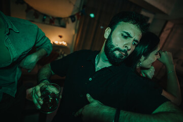 A lively birthday party with friends dancing energetically at home. The vibrant atmosphere is enhanced by ambient lighting and cheerful expressions, capturing the essence of joy and celebration.