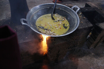 cooking lodeh in a cast iron pot