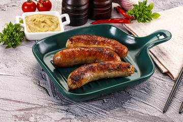 Delicous natural roasted sausages in the plate