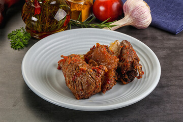 Baked beef ribs with vegetables