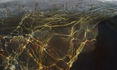Underwater Shot of Light Reflections on a Concrete Structure Creating Liquid Caustics