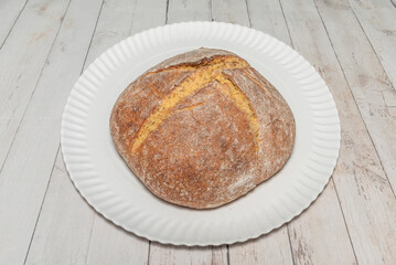 Ideally, artisan bread is baked in stone or hearth ovens, which distribute heat evenly and provide a crisp