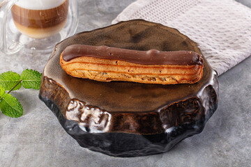 Gourmet chocolate eclair with icing
