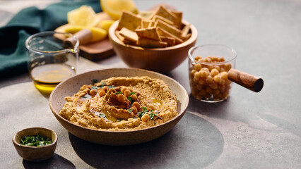 Delicious hummus with olive oil, chickpeas and parsley